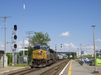 CSXT 572 & CSXT 5465 are the power on CN 327 as it crosses over from Track DX1 to the North Track at Dorval. It is also about to leave the Montreal Sub and go on the Kingston Sub. 