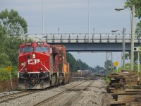 CP 143 temporarily advances towards Dorval Station during a brief period of sunshine as it puts its train together. Soon it will back up and get ready to depart westwards. In the far distance counterpart CP 142 is lined on the south track at Lachine Station and the tail end of CN 106 heads east.