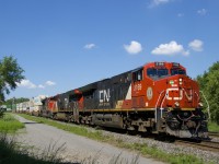 CN 120 has CN 3169, CN 3174 & CN 8867 for power and a 634-axle long train as it heads east through St-Henri. Recently this train has often not had a DPU and today's version was no exception, with all power up front.