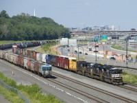 A pair of EMD's and a pair of GE's are the power on a rare daylight CN 529 (NS 7252, NS 1188, NS 4230 & NS 9284). This train has two days worth of CP 931's, which is the ID of this train when it is on CP tracks until Rouses Point, where CN picks it up to bring to Montreal. At left are a large cut of grain cars on Track 29.