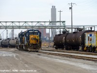 Deep in the heart of the industrial area of Sarnia, the weekend yard job is returning north to home base after finishing work for the day, passing under the usual gaggle of industrial overhead pipelines. At right in a cut of cars is the Operation RedBlock caboose (900074), one of two (900032 in Chessie paint being the other) that were assigned to Sarnia for a couple decades used for any jobs that have long reversing moves. Within a year these two would be collected by the station and sold to the Lake State Railway who have them now and IIRC have since been repainted in lsrc livery. Amazing that CSX hangs on to this isolated patch of railroad after all this time. 