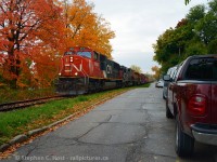 The last CN SD75i built, on short term lease to GEXR leads 432 through a brilliant kaleidoscope of reds, yellows and oranges as the crew thunders alongside upper Kent St in Guelph on a cool fall morning. This is all fenced in now, unfortunately.<br><br>The day before I captured <a href=http://www.railpictures.ca/?attachment_id=26586 target=_blank>this</a> and naturally I went back to see what else I could do. It was absolutely breathtaking in this spot at that time and it didn't last very long.