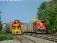 <b>Rock on</b> - Crew from the first operating GEXR job for the Guelph Junction Railway signifies to 147's hogger to rock on as they pass at the west end of Guelph Junction.<br><br>Due to paperwork issues, the all-clear to begin operations wasn't given until 1600 on September 1'st. The crew quickly began working the yard facing west, meeting T69 and 147 in the process before shutting 'er down a few hours later. Expecting the first train to Guelph tomorrow morning unless they run tonight. Anything's possible at this point. <br><br>Photo notes, 400mm lens, cropped, shot from 1'st line.