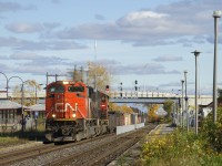 CN 321 has a pair of EMD's for power (CN 8019 & CN 5747) and 90 cars as it passes Dorval Station.