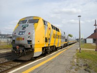 VIA 912's nose has seen better days, here it brings up the rear of VIA 62 which is stopped at Dorval Station.