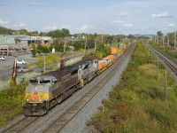 CP 143 has CP 7013 (in the script heritage scheme) and CP 7023 (the Air Force unit) as it heads west through Pointe-Claire.