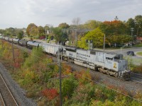 The Air Force unit (CP 7023) leads ethanol train CP 650 past a set of signals on CP's Vaudreuil Sub, with heritage unit CP 7013 bringing up the rear. This was a surprising lashup, as this train had GE units into Toronto, where power was swapped (not a particularly common occurrence for this train).