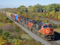 CN 368 has the GT heritage unit (CN 8952 in fresh GT paint) last out as it passes Beaconsfield just after it had met counterpart CN 369. Ahead are CN 2285, CN 5684 & CN 5776. With only CN 2285 on-line (and restricted to notch 7), this 117-car train is not making track speed.