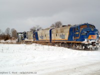 This was my first plow chase, and to say it was a great one is an understatement. With three matching RLK units it didn't matter if you shot the train coming toward you , or going away. With a bit of sun peeking through the angry skies, the extra is westward bound entering Goderich town limits as they have plowed northward from Clinton Jct. They will return to Clinton, wye, then plow south and I chased both ways. Despite the white knuckle drive it was so worth it. Thanks to a friend for the heads up, you know who you are!<br><br>
Both of these F units ended up on OSR and they only ran together for an OSR plow in RLK paint<a href=http://www.railpictures.ca/?attachment_id=18316 target=_blank> once </a>. I had to be there of course. More to come.