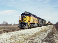 Beautiful Sunday afternoon; I have marked in my notes 1335 hrs as the time I shot this westbound on the second day of April 1978 at Sunset Drive, the last crossing west of Fort Erie before the QEW. C&O 4283,3521 and 3023(GP30)make up the power, with 37 cars and caboose C&O 3525. This track is long gone.  On the extreme right one can see the pole line for CN Stamford Sub.