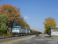 After dropping rail on track 2 of CP's Westmount Sub, a rail train powered by CMQ 9011 & CMQ 9014 is heading back to St-Luc Yard just before the start of the afternoon commuter rush hour on this normally passenger-only line.