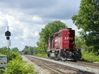 CP 5792 is running around its train and will soon run back to St-Luc Yard long hood forward with empty ballast cars.