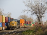 CN 327 with intermodal up front passes an intermodal train stopped on track DX-1.