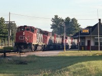 Got fooled by this one. Saw the string of head end power coming around the bend while at the station taking pictures. Backed up abut as far as I could go and thought I had all the units, 5 of them, in the shot. But no, there was a 6th, CN 4521 that didn't quite fit in the photo.
This Toronto to North Bay train was very late in the day, the shadows lengthening quickly.  So nice set of GP40-2s up front; CN 9426, 9619, 9654, 9447 and 9603.
Currently the VIA station is up for rent. It sits empty.
None of the GP40s remain on the CN roster. It is surprising that after 40 years only 9619 is officially retired.  The 9426 is now RLK 3029, 9654 is Central Michigan 9712, 9447 went to Alstom in 2001 and 9603 went to the DMVW in 2002.