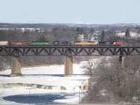 For awhile there in the spring of 2007 we were treated to all kinds of road schemes and leasers mixed in on CNs trains. Witness this example running eastward over the big trestle at Paris: CN 2227, UP 4087, IC 6059 and CEFX (BN)7111 as train #398.