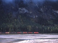 As seen across the Kicking Horse River, a westbound CP with 5520, 5574, 55xx & 5641 works its' way thru the mountainous terrain toward Golden. Shortly, the railroad will duck under Trans-Canada Highway #1, enabling me to have a chance to grab engine numbers.