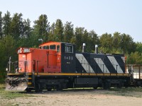 I was rather pleased to find Torch River Rail's GMD-1u sitting at it's headquarters in Choiceland. But, it looks as though the stacks are capped.
Wondering what this is all about, knowing they only have the one unit. Perhaps this road only ships grain and the season is done?  Just curious.
Of the photos I shot of this unit, I liked this one best, although against the weak sun of the day. This locomotive came from CN at the startup of the 27 mile TRV in 2008.