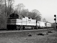 My assumption is that this is the morning International, the AMTK train that passed thru Bayview around 0900 for Chicago from Toronto. But it sure doesn't look like one. Second unit is VIA 6901, an LRC-2. I have accounted for VIA #71 this morning, so this leaves me no other guess. Nice quiet morning, after all it is a Tuesday, and thats the way I liked it. 
Those LRCs were real lemons. Endless problems with them resulted in the whole fleet of 6900-6930 lasting about 20 years. The 6901 pictured was built 1980 (as was the AMTK) retired 2001 and sold to Industrial Rail Services in 2003. 
Photo shot using B/W 400 ISO medium format (2x3 inch negs) film in a graflex roll film holder in back of a 4x5 Speed Graphic. All that fumbling around when today one can just grab the digital and shoot!!