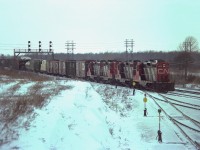 Geez........one of those blustery cold days deep in the bowels of winter. Groundhog Day, actually. In this rather frosty view, CN GPs 4576, 4579, 4563 and 4525 have just passed CN Duff and are bringing their train into the west end of Fort Erie yard.  I have no information on this mixed freight other than if I recall correctly all those GPs were based here.