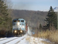 CP 251 is working hard with an 81-car train as it climbs a grade with a trio of EMD's for power (CMQ 9020, CMQ 9017 & CP 6018).