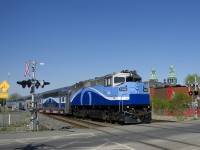 Bearing markings for neither AMT, nor EXO on its nose or long hood, F59PH AMT 1348 leads EXO 1209 over the Courcelle crossing as it heads towards its final destination of Mascouche.