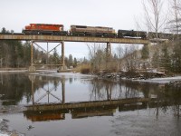 After having shot MMA, CMQ and Orford Express trains at this well known location, its still somewhat of a shock to me to be shooting a CP train with CP power here. Here we see CP 251 crossing the Eastman trestle, with EMD power CP 6018 & CP 7011 reflected in the still water.