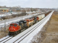 One of the class lights is lit on trailing unit BCOL 4607 as CN 321passes MP 14 of CN's Kingston Sub with 89 cars out of Southwark Yard. Leading is CN 8958 and CN 8001 is the third unit.