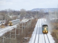 VIA 67 on CN's Kingston Sub is ahead as EXO 61 heads in the same direction on CP's Vaudreuil Sub at left.