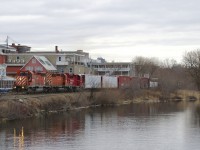 CP 251 is following the Magog River as it slices through the town of the same name with CP 6018, CP 6024, CP 2266 and a respectable 68 cars on an overcast morning. This pair of SD40-2's has now made three round trips from Montreal to Maine.