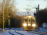 The sun has risen high enough to illuminate EXO 932 as it passes the siding at MP 16.9 of the Deux-Montagnes Sub during the final morning rush hour for this line. Already truncated so that trains terminate at Bois-Franc Station since this past spring (instead of going all the way to downtown Montreal via the Mount Royal tunnel), the rest of the line will be shut down and all the tracks and infrastructure torn up after today. It will be replaced by the controversial REM light rail project, which is only set to be in service here during Q4 2024. 