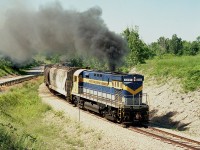 (Port Colborne Harbour Railway became Trillium a few years after its conception)
    Although the official Opening Festivities did not take place until July 2, 1997; the PCHR was out and about by the latter part of June.
    In this image, former NY&LE 6101 did its best to show us what it was, an ALCO, as the C-425 throttled up pulling away from the Robin Hood Mill area on its way to Casco and the WH yard, just a few miles down the line.

    The PCHR started off as a 7.7 mile line connecting Welland and Port Colborne. It was operated by the Caledonia and Hamilton Southern Railway, Ltd. (I'm wondering what ever became of that outfit)
    The much traveled NY&LE #6101 came to the PCHR as their sole locomotive, as the "C&HSR" was affiliated with the New York & Lake Erie. In 1991 the 6101 was returned to the NY&LE and then ended up on the Delaware-Lackawanna in Scranton, PA in 2007; where it still resides today. Doubt it has quit smoking.