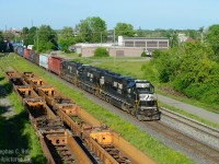 Adding to the Fort Erie pile by Rob and Arnold, here's a funeral train of sorts, and one that would largely have gone un-noticed. Trailing the pair of matching SD40E's is NS 2801, the last NS SD75i sent across the border for scrap at K&K Pickering. 2801 would join 3 others waiting in Fort Erie before heading east to Toronto.