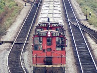 Hard to believe this image was taken from off the Waterdown Rd bridge in Aldershot, looking east. Today you would see a lot more track, as in yard leads; plus GO and VIA platforms and the Aldershot GO station off to the left. It has all changed. But then, this photo is from 45 years ago.
In the view, CN 1238 and 1322 are westbound, perhaps to Hamilton, with mixed freight. I miss these versatile little switchers.