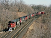 Nice collection of power as seen from the Plains Road bridge out in Aldershot. Train #433 is a Toronto to Windsor run, and today the head end features three MLW M-420s within the consist of  CN 3513, 5117, 3509, 3502, 9433 and 7311. The 420s were already beginning to be retired and dealt off by this time.