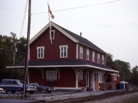 What a beautiful building. This former station is one of the oldest in Canada, with a construction date of Jan 1, 1858, and finished later that year for the European & North America Railway. This line ran from Saint John to Shediac, NB., back when the community was referred to as Kennebecasis. Cost of construction of this 3,000 sq ft structure back then was $2,500. 
The standard two story building as a passenger station was closed in 1975, despite the 'Atlantic' running thru until 1994. A rather cute VIA waiting room was built off to the left of where I am standing for those passengers that still used the service.
Recently a local photographer, Martin Flewwelling had his studio and gallery there on the main floor and the lower area was used for town meetings and such. It went up for sale for $325,000 in 2019. A classic, and since it was thoroughly renovated top to bottom and contained many artifacts, was probably cheap at twice the price.:o) With a road behind and active CN track in front, the only drawback would be lack of private property.
The structure as a National Historic Site of Canada.