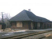 It is rather obvious the days of railroading over the CP in Elmira have ended. The track is rusted, the station is boarded up and even the doors are gone from what looks like the "his" and "hers" pots out back. This former  CP line is now part of the Kissing Bridge Trailway, which consists of a good portion of the old Guelph to Goderich Railroad that used to run thru here. The station, and small yard, land was sold to Martin Milling (Martin Feed Mills) who built a new structure here when they diversified into Elmira Pet Foods in 1979 (now Elmira Pet Products). CP abandoned what was left of the rail line in early 1988. I'm guessing the station, which was on the north side of the tracks at North Arthur Street, came down around 1976.