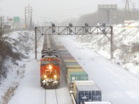 CN B730 is passing CN 149 on a bitterly cold morning.