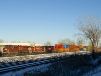 CP 143 has an SD40-2 in the dual flag paint scheme second as it passes through Dorval with 32 intermodal platforms followed by 72 autoracks. Power is CP 8711, CP 6012 & CP 8008.