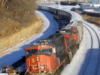 Class leaders CN 5600 and CN 2500 are the power on a 52-car CN 527 as it rounds a curve in Montreal West.