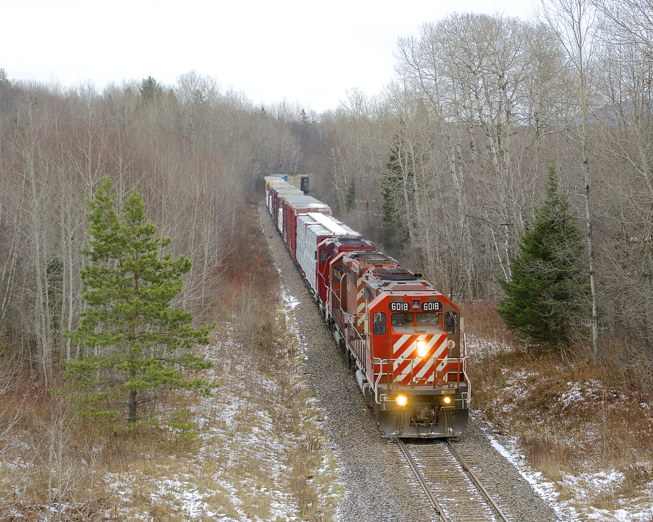 CP 251 is passing MP 100 of CP's Sherbrooke Sub with CP 6018, CP 6024 & CP 2266 for power.