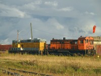 Due to the location of these locomotives and the rather dire weather forecast for the day; I waited out rainstorms, winds and generally lousy conditions hoping to get a photo of these two locomotives in sunlight.As luck would have it, the sun came out briefly in the very late afternoon and I was pleased with this shot. (Note a weak rainbow in the top right corner of this image).
Inside the fenced Rayonier (former Tembec) facility in Kap these two units look as if their days are done. The Spruce Falls S-13 #108 was acquired new by the company back in 1967. The former Mattagami RR #168 GP7 was acquired in 1998. (Before its Mattagami days, this unit toiled on Algoma Central as their 168)
While visiting there all rail activity at the plant was handled by a DESX 5176 (Diesel Electric Services)switcher. So the old units are probably expendable.
Rayonier is a producer of quality newsprint and other similar products.