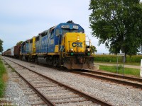 Tuesdays or Thursdays were the days to shoot CSX's Chatham to Blenheim-Sarnia turn, or if you wanted to cover the Sarnia subdivision end to end. I took a couple days off work so I could chase on a Thursday and my wife could do more wedding planning (A fair trade - we got married in Sarnia a month later). For whatever reason I also chased D725 south that morning.... which made for a very long day. But I have no regrets :)
<br><br>
12 hours after my first photo I stood here growing tired of the chase but placed the train at the Wallaceburg SNS - the actual station was a half mile timetable north. I'd go for a couple more shots then call it a night, in 7 months CSX would drastically curtail operations, effectively abandoning Dresden to Chatham, and selling to CN Chatham to Blenheim. Wallaceburg would go from 16 trains a week to four and it would stay that way until the line was sold to Chatham-Kent in October 2013. Chatham Kent has recently sold the line to a numbered company and we're waiting to hear what their plans are... 