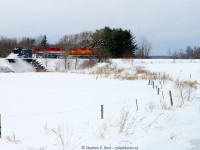 North of Hensall is the small town of Kippen, where a small bridge crosses the Bannockburn River. As the first GEXR plow to run on the Exeter sub in 14 years heads southward, GEXR 55403 rattles the timbers causing snow to fall onto the frozen river below.