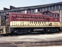 Nice sunny morning image of the TH&B 56 sitting outside the roundhouse on Chatham St near Aberdeen. This unit, built in 1950; was one of four SW9 switchers on the TH&B roster at the time. It was retired in 1988.