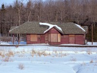 The old CN station in Mount Albert was along the Bala sub just across from Hwy 48 that went by the town. The first time I stopped there, maybe in 1976; it was abandoned. Doors open, ransacked by vandals and the curious. Passing by again in early 1978, it was a surprise to see the place all bordered up. I thought it was going to be moved locally for a residence, perhaps. But no. This station, built by the Canadian Northern in 1906; was to become a player in a new Cannington Historical Society museum in MacLeod Park, in that town. I understand the park opened in 1978, so the move must have taken place not long after this photo was taken. It now sports a "Cannington" namesign on it; a bit misleading perhaps, but it fits in as part of a Cannington historical display, and I doubt many question it.