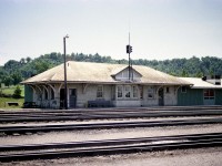 Most of the fans in Southern Ontario are familiar with the TH&B Yard Office at Aberdeen, off Aberdeen Av opposite the Chedoke Golf Course on Studholme. It has changed very little over the years; and this image taken 43 years ago could almost have been much more recent. It looks like an old passenger station, and once upon a time it was.
I do not have much information on it as such and would appreciate hearing from anyone. My TH&B timetable of 1916 shows only one daily passenger train that stopped here. And by then it was only a flagstop. It is almost amusing the timetable shows this train leaving Waterford at 630PM as the Toronto-Montreal Express #10. Dream big. The train was scheduled thru Aberdeen at 7:51PM and into downtown Hamilton for 8PM. Then, via CPR; off toward Toronto, leaving 820PM and arriving in the Big Smoke at 9:23PM. It was to arrive in Montreal the following morning.
The station was built in the 1890s, and evidently was lightly patronized.