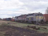 The old Canadian American Railroad. From 1994 to its bankrupt end in 2002. Really, there is no other collection of railroads in Canada in my mind as confusing as this bunch.
CDAC operated former CP lines between Lennoxville Quebec and Brownsville, Maine, beginning in 1994. The Quebec Southern operated former CP lines between Montreal and Lennoxville, beginning in 1996; same year as Northern Vermont took over operations running from CPs line south from Brookport, Quebec into Vermont. It became under the Bangor & Aroostook System as well; all of this owned by a holding company called Iron Road Rwys. Confused?
Anyway, the conglomerate built up business rather intensively, but neglected the physical plant to a degree that deferred maintenance eventually led to bankruptcy in 2001 and in 2002 it was all taken over by Montreal, Maine and Atlantic (MM&A...Yes, the Lac Megantic tragedy) 
Anyway, seen here is (CDAC) BAR 350 (formerly BAR 81), Amttrak 397 (leased ??) and HATX 176 (leased) rolling thru some rather unkempt right of way. The GPS location indicated is only approximate.