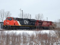 I heard that CP #246 today was going to be heading down the Niagara area with a CN as trailing unit. It was a blustery cold and windy day today and I was not in the mood to head out to wait anywhere for this particular train.  Perhaps the CN will be leading tomorrow Feb 6th as train #247? Not to worry. If it does, this is what it will look like.  CN 3026 and CP 8813 stopped at the Welland Yard office as train #255 close to three years ago. There. I have just saved a trip to Welland. :o)