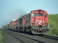 While out on a day off; just 'cruising' the Dundas sub; came across this eastbound freight. Moving very slowly, as it looks as if someone is addressing a problem down on the third unit.  The Budds westbound have just one by.
Power consist is CN 2029, 2025, 2564, 9464 and 9501. I found it interesting it is still not ribbon rail on the track it occupies.