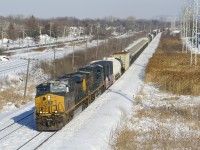 CN 327 has CSXT 3205, CSXT 477 and 84 cars as it heads west through Pointe-Claire.